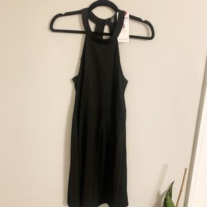 BRAND NEW cute little black dress. Open back!